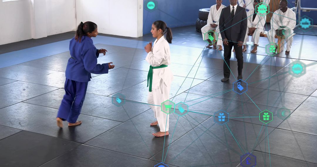 Young judo athletes sparring with referee and judges, digital tech network overlay