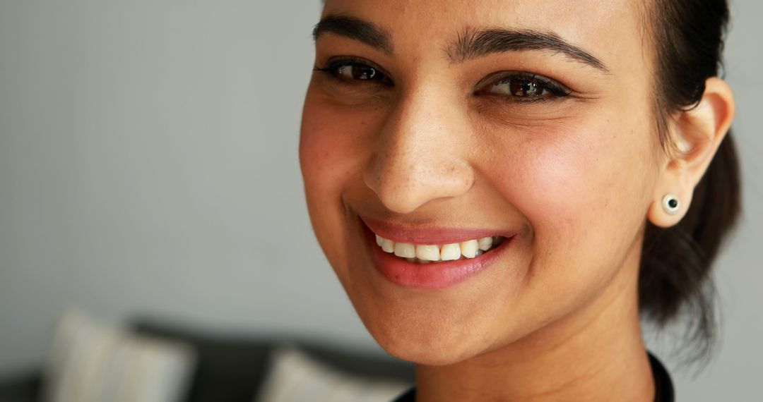 Close-Up Portrait of Smiling Young Asian Woman with Copy Space