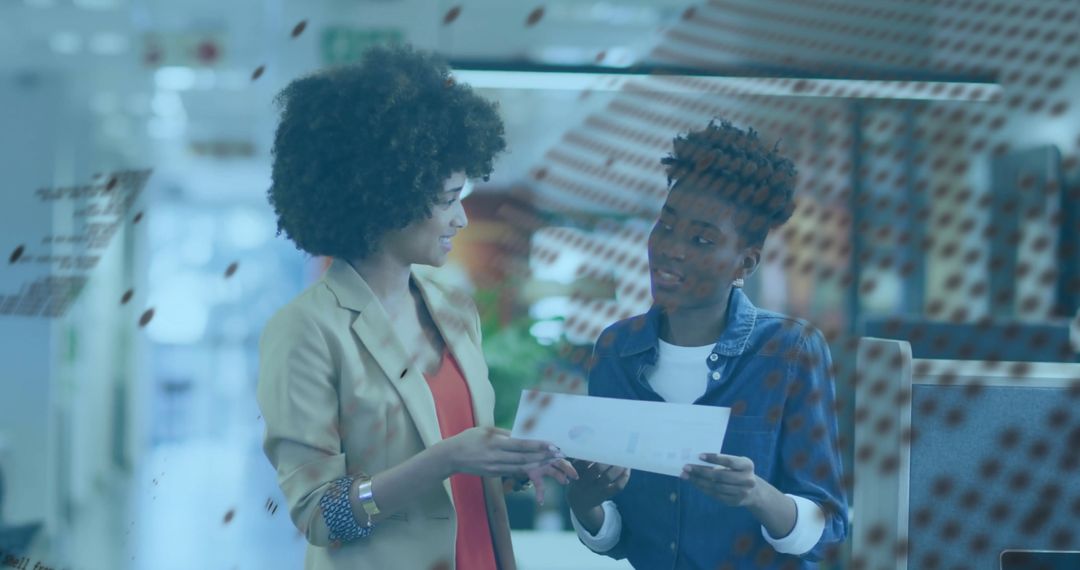 Dynamic Businesswomen Collaborating in Modern Office Space