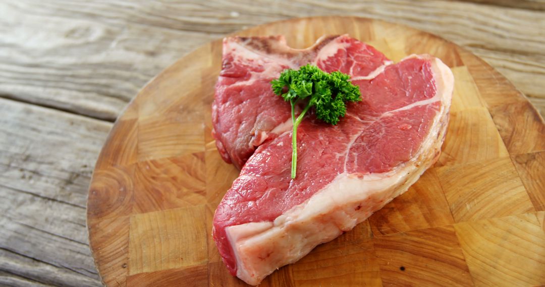 High-Quality Raw T-Bone Steak on Wooden Cutting Board - Free Images, Stock Photos and Pictures on Pikwizard.com