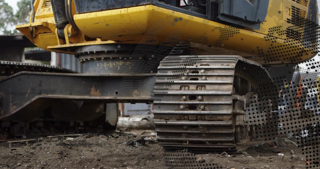 Yellow Excavator Tracks Navigating Construction Site Terrain