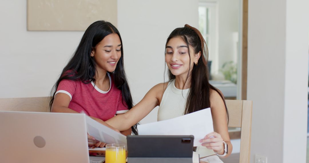 Friends Collaborating at Home with Technology and Refreshments