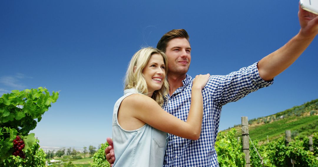 Couple Taking Selfie in Sunny Vineyard - Free Images, Stock Photos and Pictures on Pikwizard.com