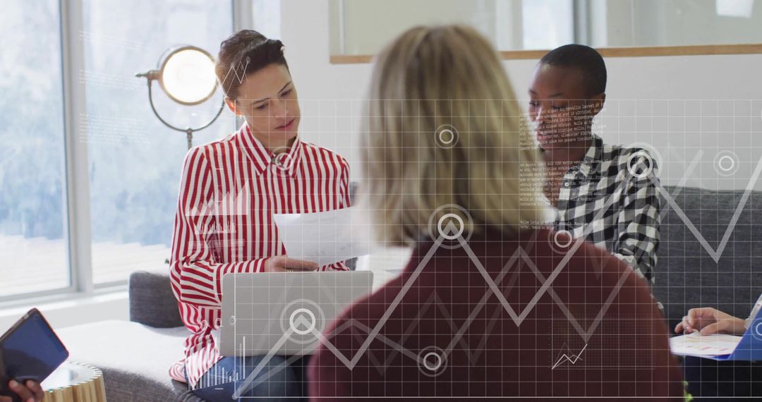 Diverse Team Analyzing Data with Digital Graphics Interface