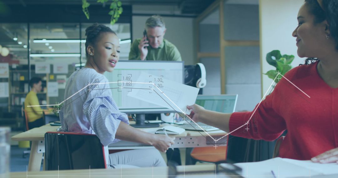 Team Collaborating on Data Analysis in Modern Office