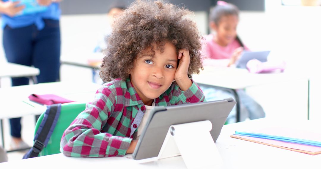 Child Using Tablet in Classroom Embracing Digital Learning
