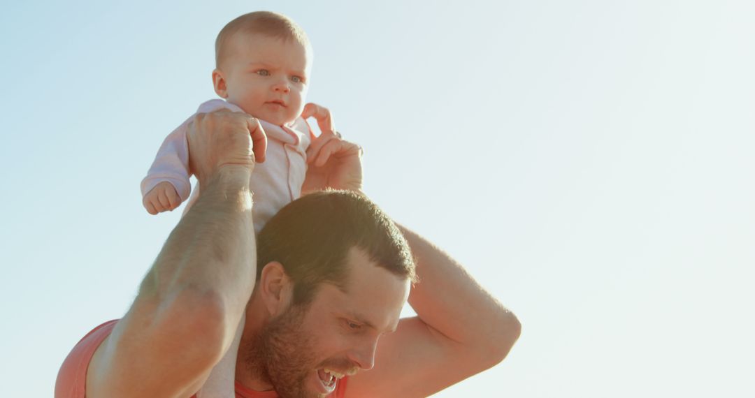 Father Carrying Happy Baby on Shoulders Outdoors - Free Images, Stock Photos and Pictures on Pikwizard.com