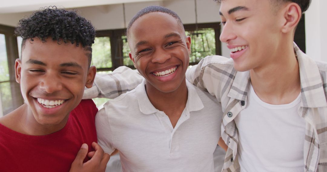 Group of Three Diverse Teenage Friends Smiling Indoors - Free Images, Stock Photos and Pictures on Pikwizard.com