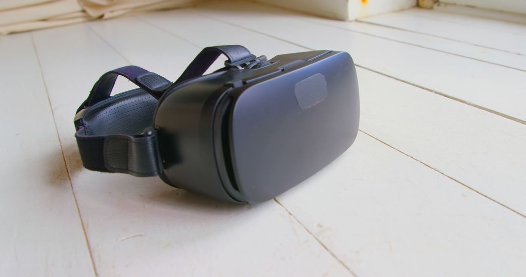 Close-Up of Virtual Reality Headset on Wooden Floor - Free Images, Stock Photos and Pictures on Pikwizard.com