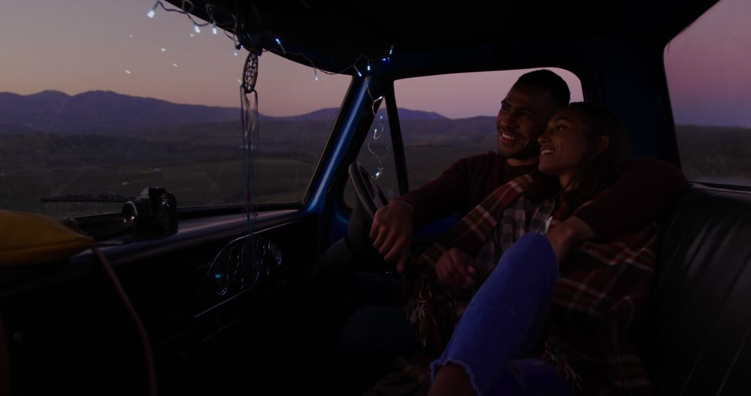 Young Couple Enjoying Romantic Evening in Car with Mountain View - Free Images, Stock Photos and Pictures on Pikwizard.com