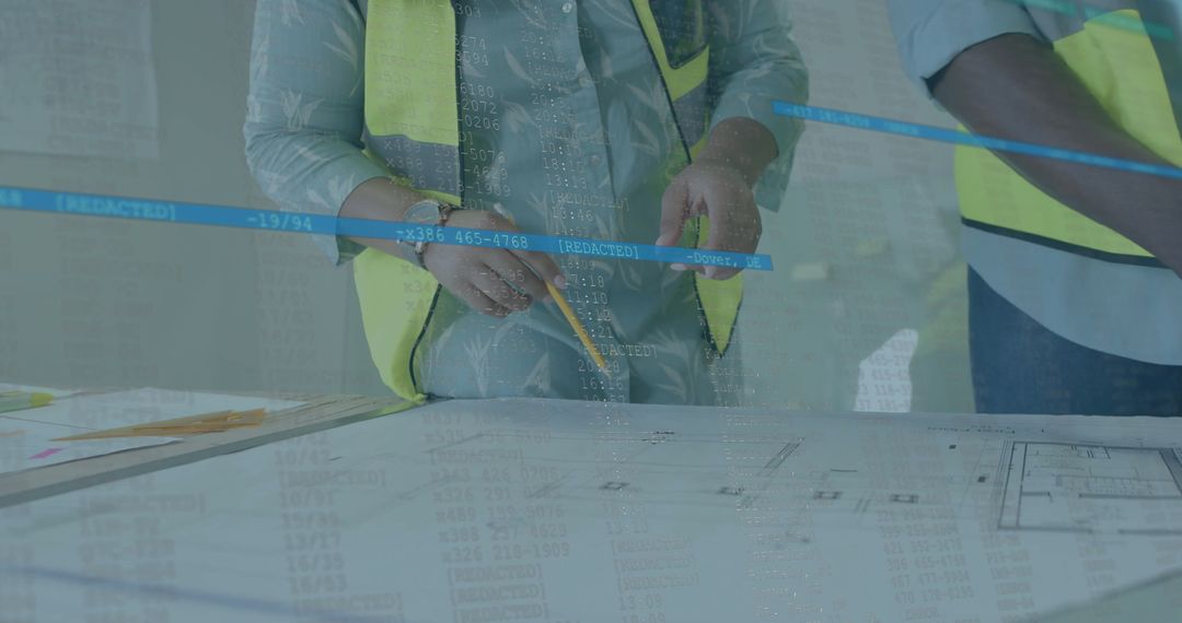 Engineers Collaborating Over Blueprints with Data Overlay