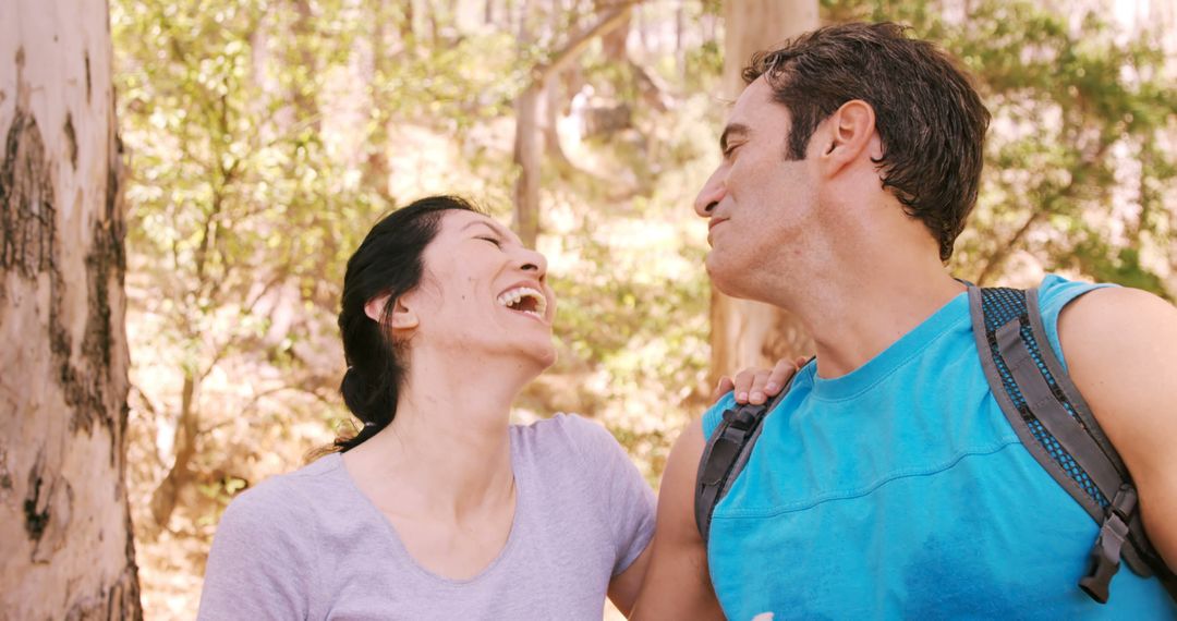 Happy Couple Laughing on Forest Adventure