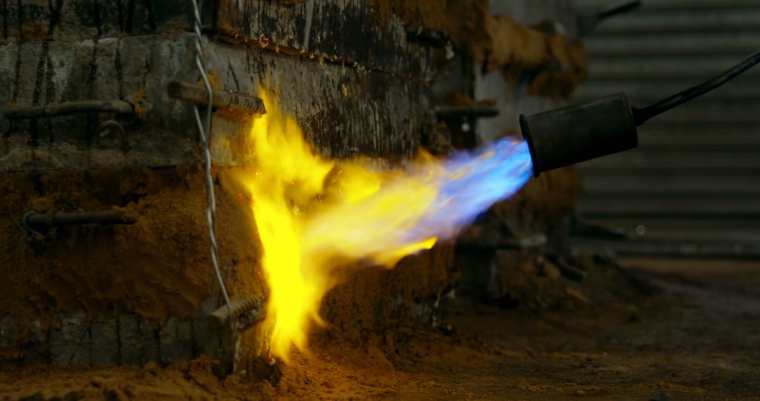 Industrial Blowtorch Heating Metal with Blue and Yellow Flames - Free Images, Stock Photos and Pictures on Pikwizard.com