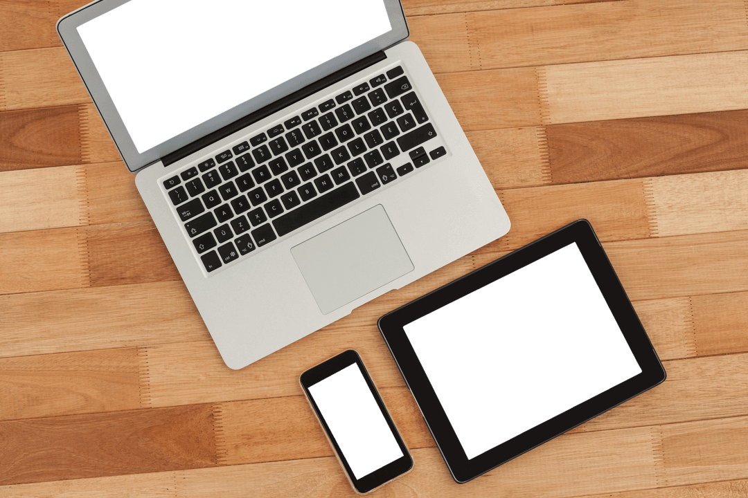 Transparent Devices on Wood Surface Featuring Laptop, Tablet, Phone