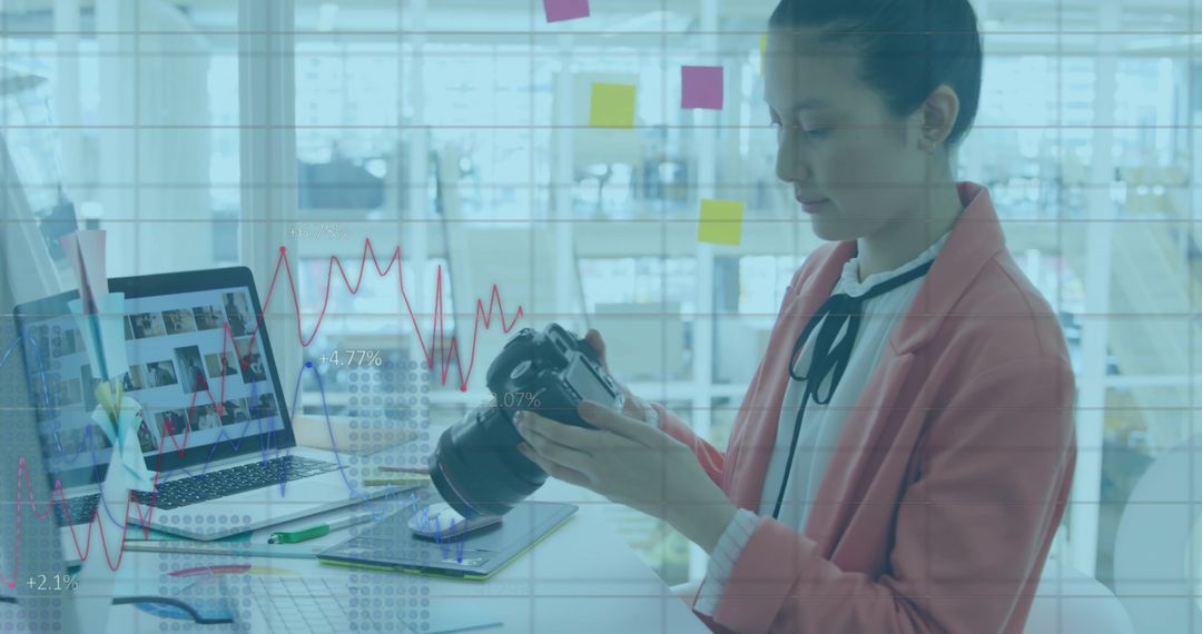 Female Creative Using Camera for Digital Project in Modern Office