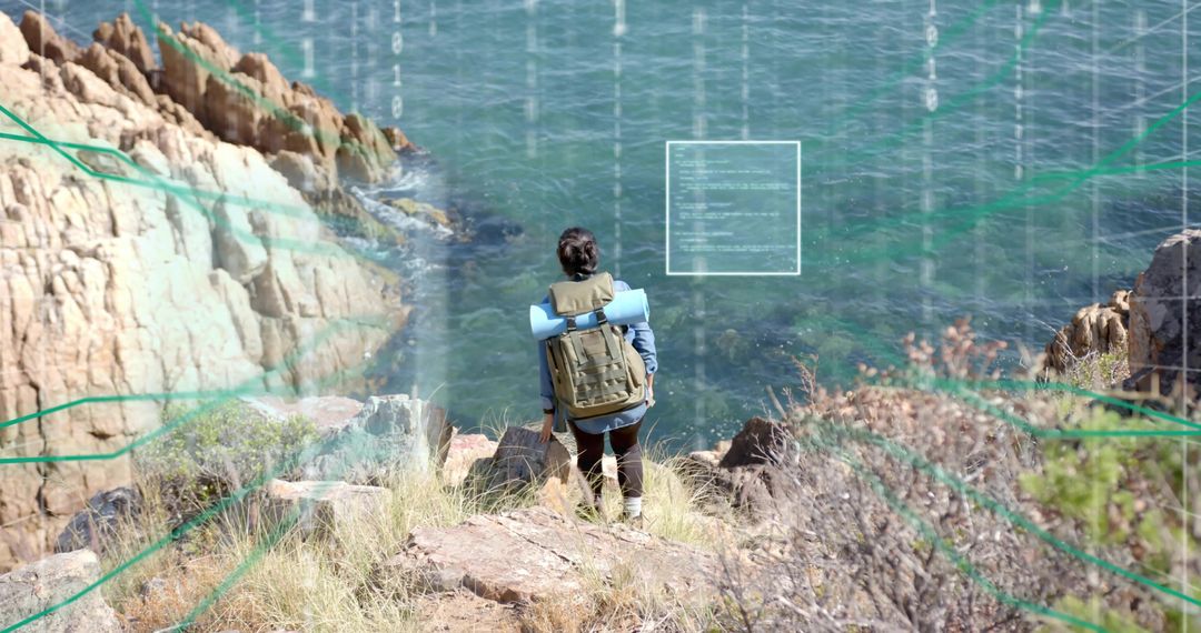 Adventurous Hiker Overlooks Ocean from Clifftop
