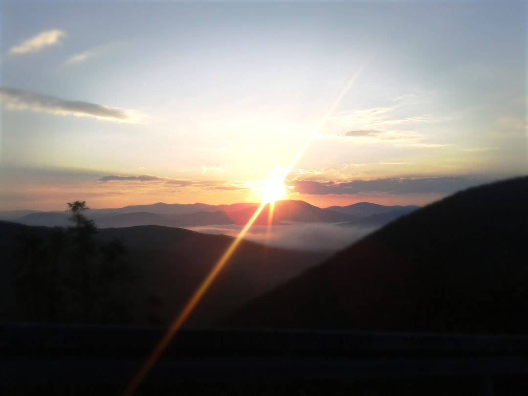 Breathtaking Mountain Sunset Over Misty Valley - Free Images, Stock Photos and Pictures on Pikwizard.com