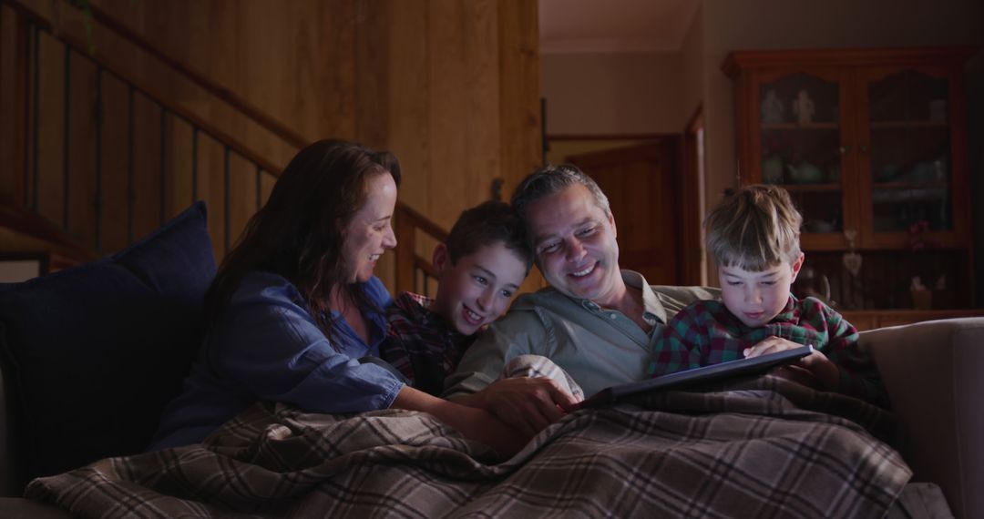 Happy Family Relaxing with Tablet in Cozy Living Room - Free Images, Stock Photos and Pictures on Pikwizard.com