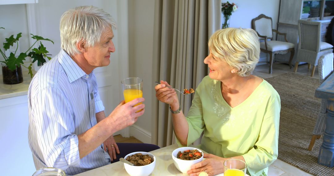 Senior Couple Enjoying Healthy Breakfast Together at Home - Free Images, Stock Photos and Pictures on Pikwizard.com