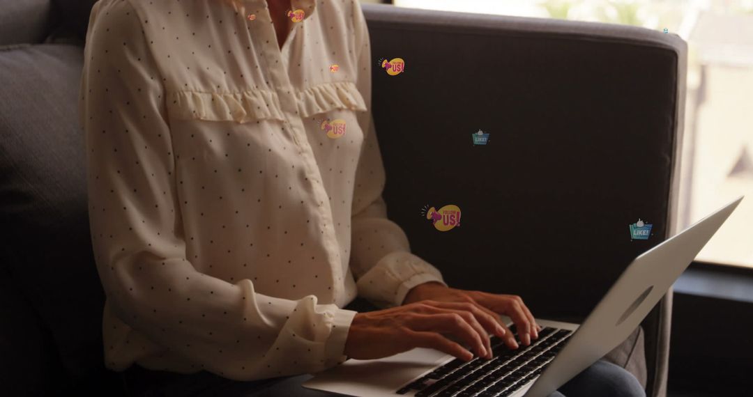 Woman in Polka Dot Blouse Typing on Laptop at Home