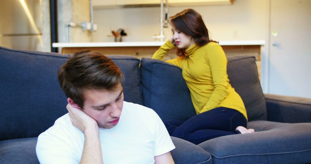 Couple Facing Conflict on Sofa at Home