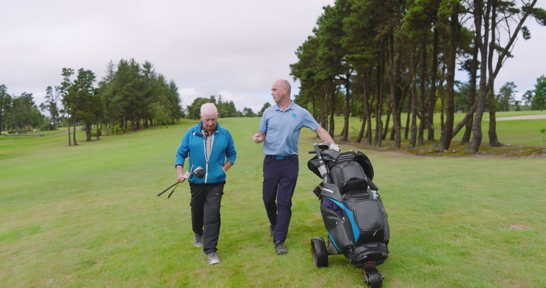 Senior and Mature Men Enjoying Leisurely Golf Game on Scenic Course