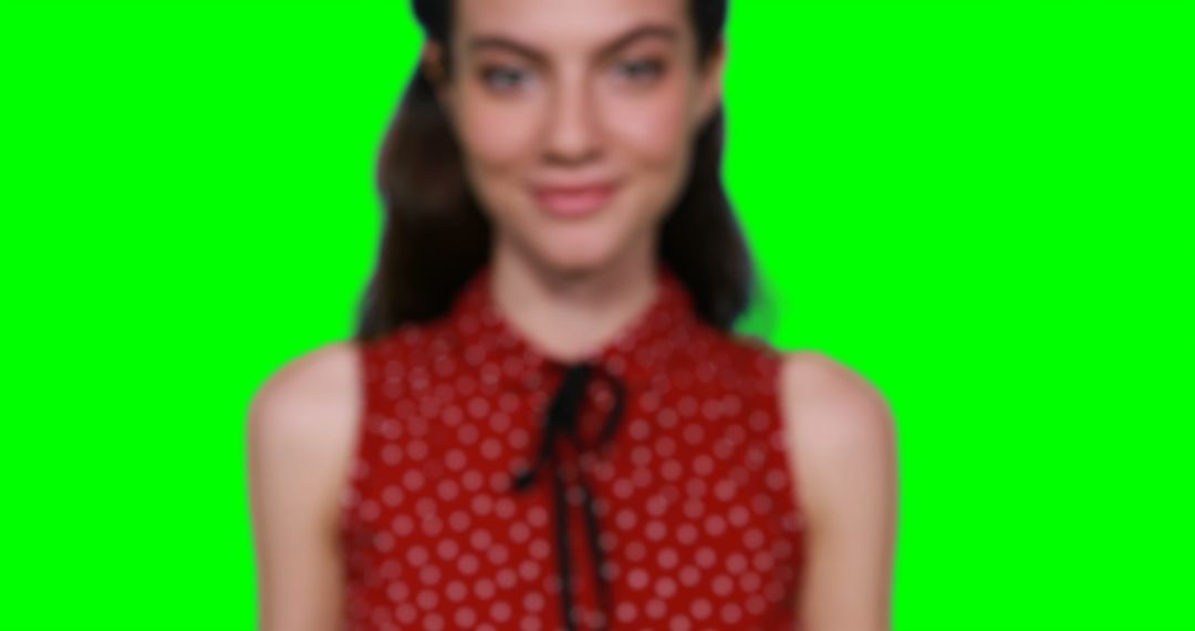Woman in Red Polka Dot Top with Green Screen Background - Free Images, Stock Photos and Pictures on Pikwizard.com