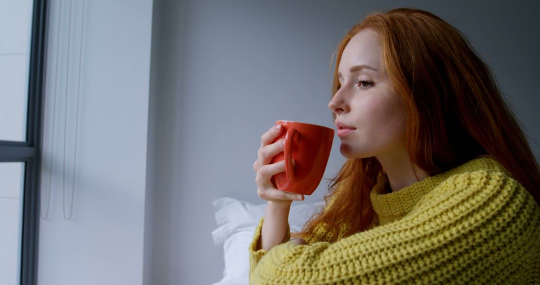 Pensive Woman Drinking Coffee by Window - Free Images, Stock Photos and Pictures on Pikwizard.com