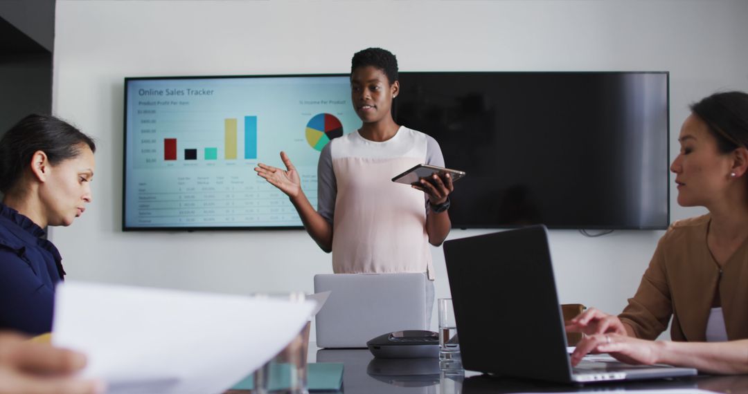 Businesswoman Presenting Statistical Data in Office Meeting