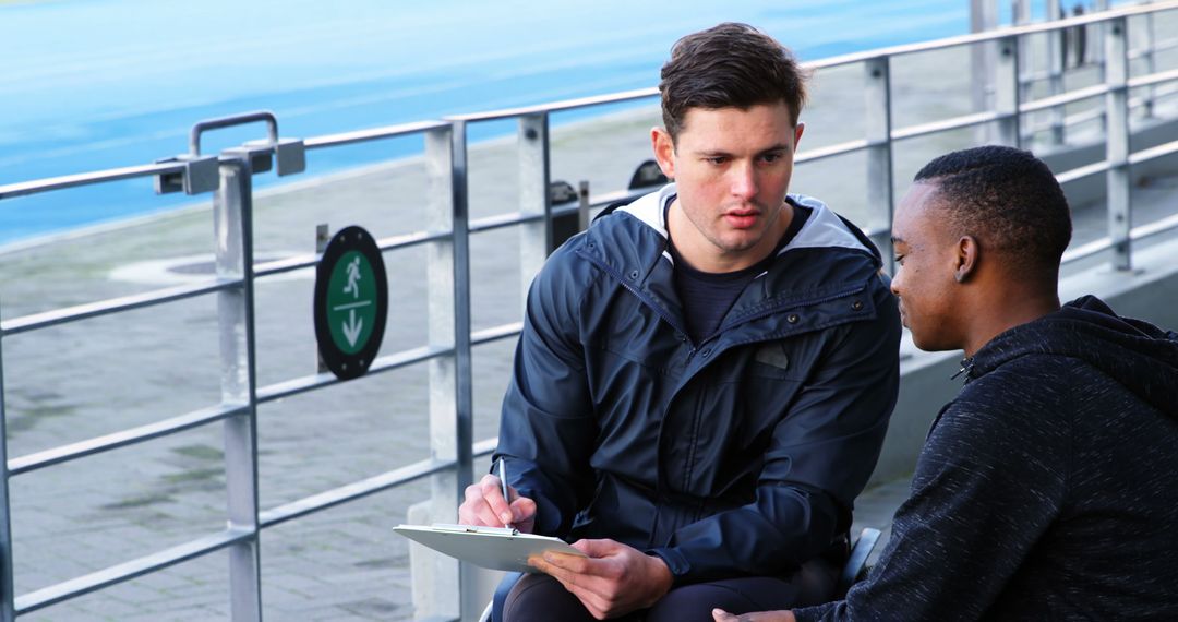 Mentoring Session Outdoors Between Tutor and Student