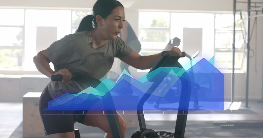 Caucasian Woman Cross Training on Elliptical with Digital Data Overlay