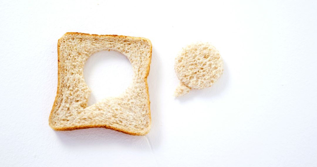 Slice of Bread with Circle Removed Isolated on White Background - Free Images, Stock Photos and Pictures on Pikwizard.com