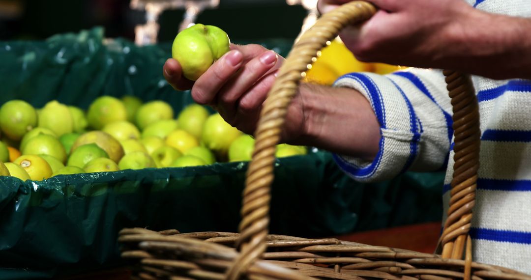 Person Selecting Fresh Green Apples at Farmers Market - Free Images, Stock Photos and Pictures on Pikwizard.com