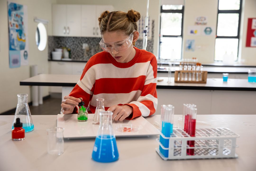 Teenager Conducting Experiment in School Science Laboratory
