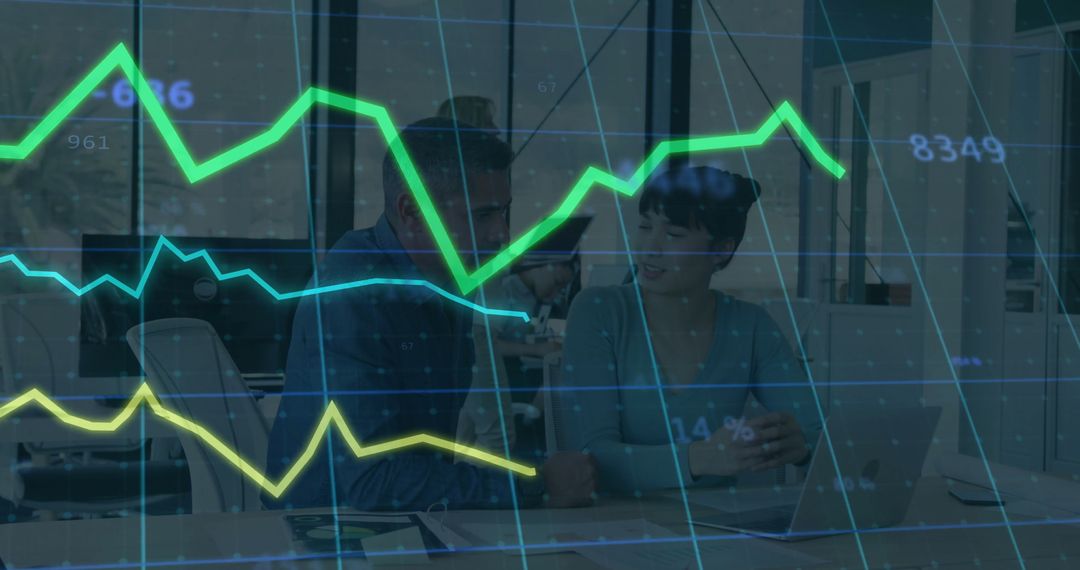 Colleagues Analyzing Business Metrics with Digital Charts