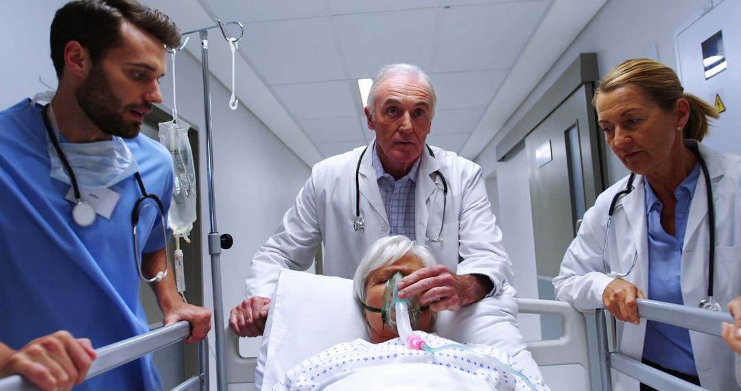 Medical Team Assisting Elderly Patient in Hospital Emergency Corridor - Free Images, Stock Photos and Pictures on Pikwizard.com