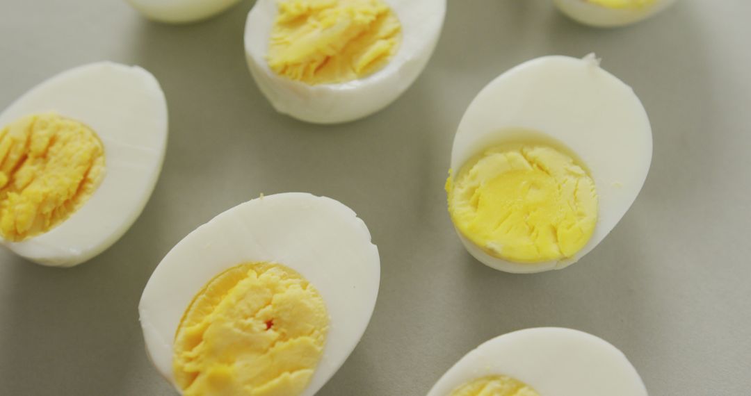 Close-up of Halved Hard Boiled Eggs on Gray Surface - Free Images, Stock Photos and Pictures on Pikwizard.com