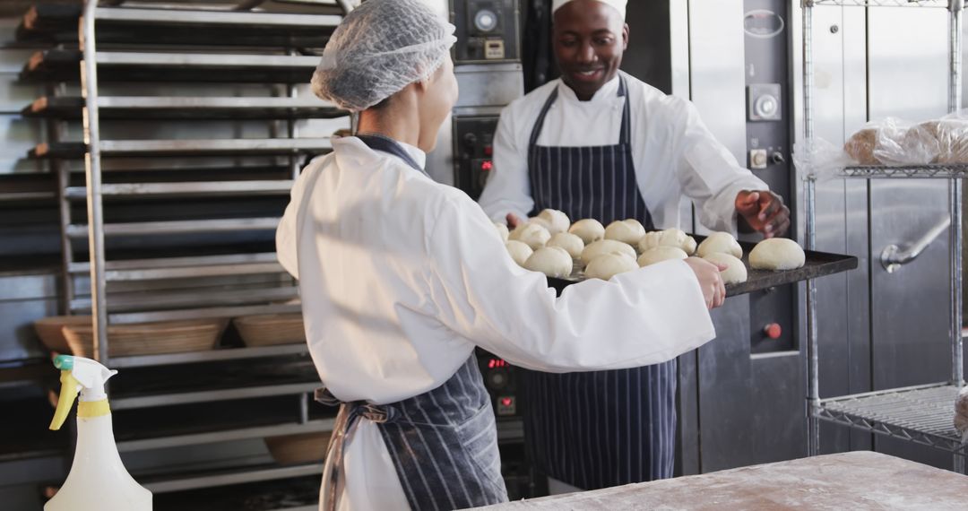 Bakers Preparing Dough Balls in Industrial Kitchen - Free Images, Stock Photos and Pictures on Pikwizard.com