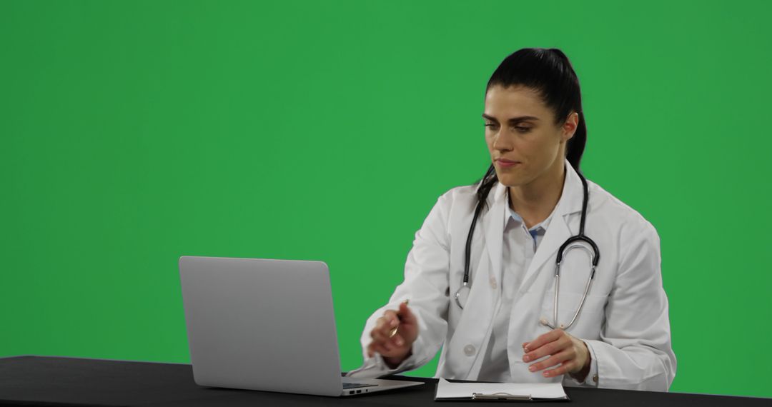 Female Doctor Working on Laptop with Stethoscope Around Neck - Free Images, Stock Photos and Pictures on Pikwizard.com