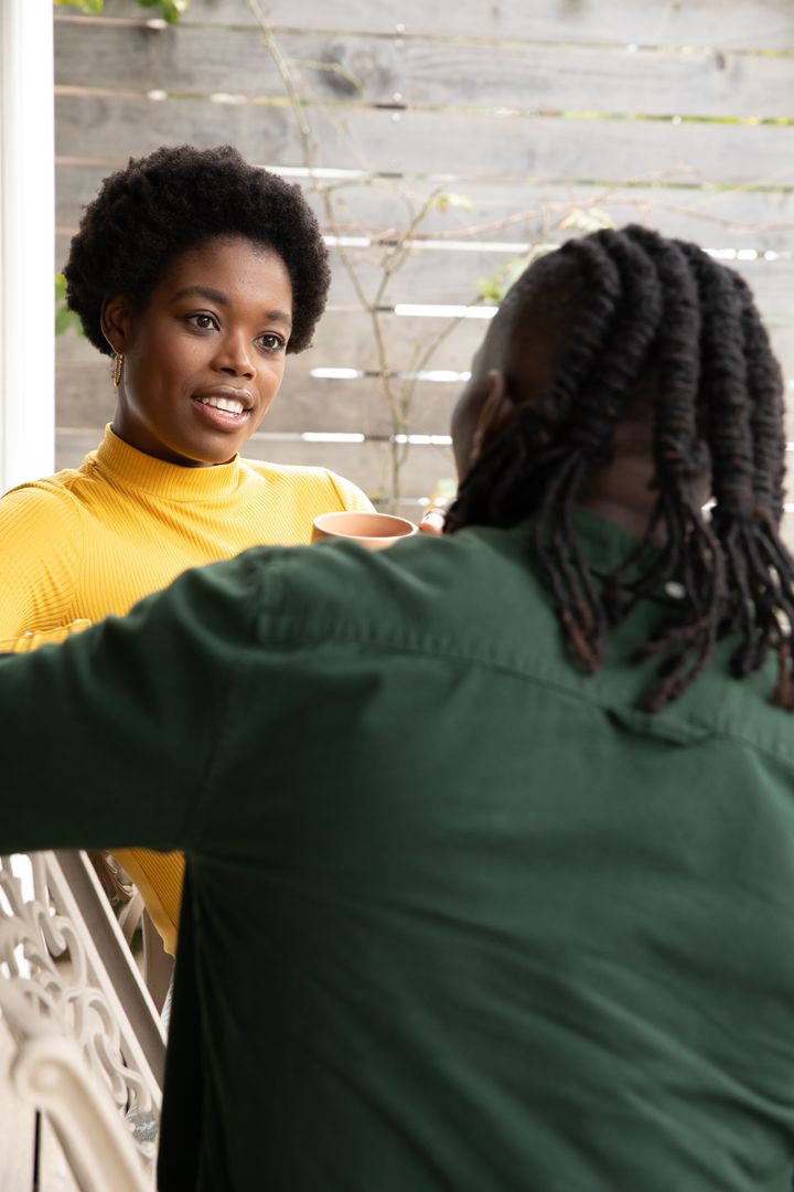 Friends Enjoying Conversation on Outdoor Patio