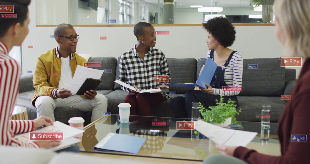 Diverse creative team collaborating in modern lounge meeting with documents and coffee