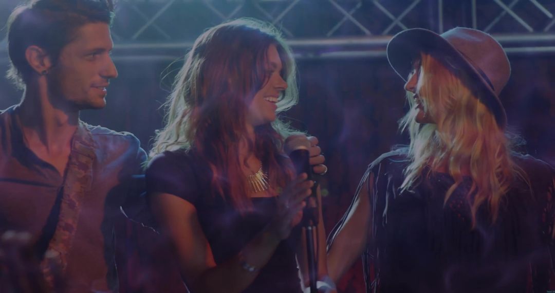 Musicians Performing on Stage Smiling and Collaborating