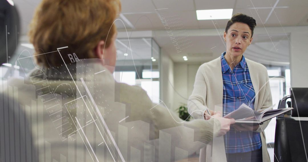 Coworkers Collaborating in Modern Office with Documents in Hand