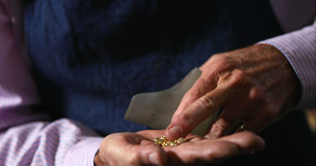 Jeweler Inspecting Gold Nuggets in Hand Close-Up - Free Images, Stock Photos and Pictures on Pikwizard.com