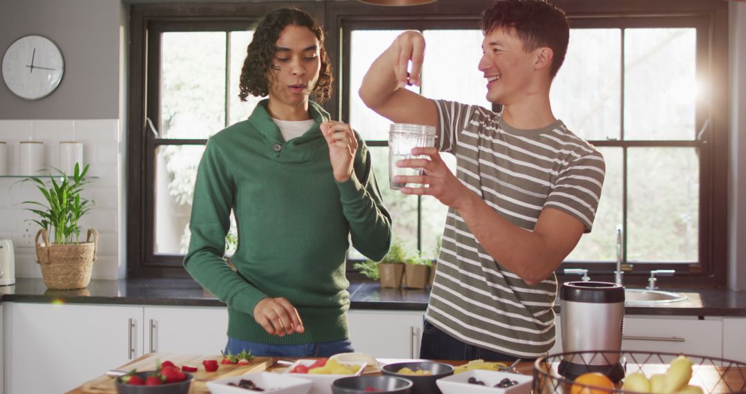 Diverse Male Couple Making Healthy Smoothie in Stylish Kitchen - Free Images, Stock Photos and Pictures on Pikwizard.com