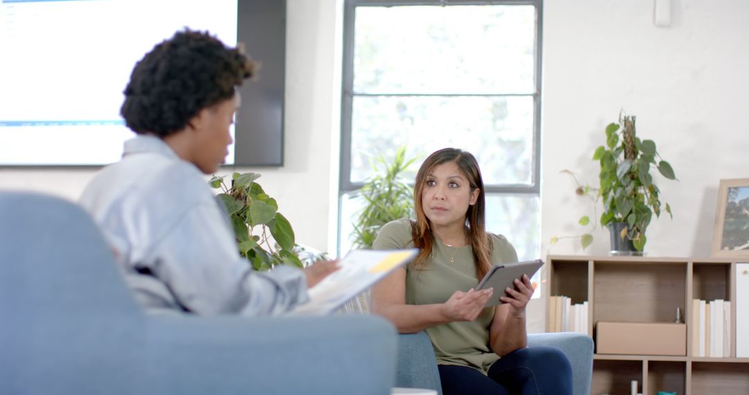 Two Women Having a Business Discussion in a Modern Office - Free Images, Stock Photos and Pictures on Pikwizard.com