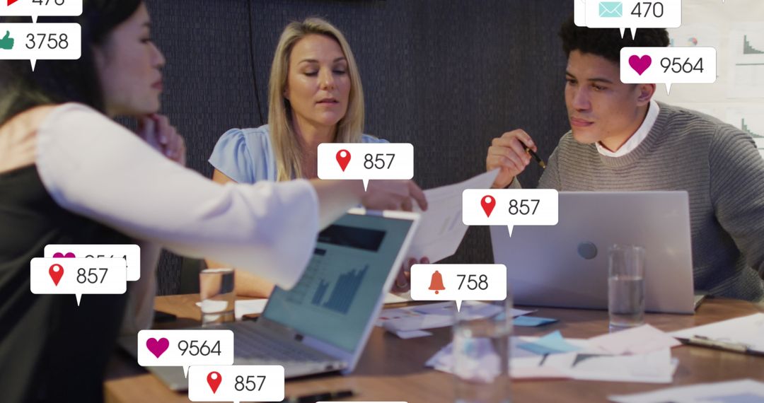 Team Collaborating on Social Media Analytics in Modern Office