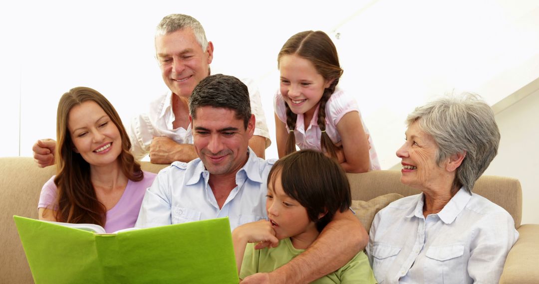 Family Reading Together on Couch, Enjoying Quality Time - Free Images, Stock Photos and Pictures on Pikwizard.com