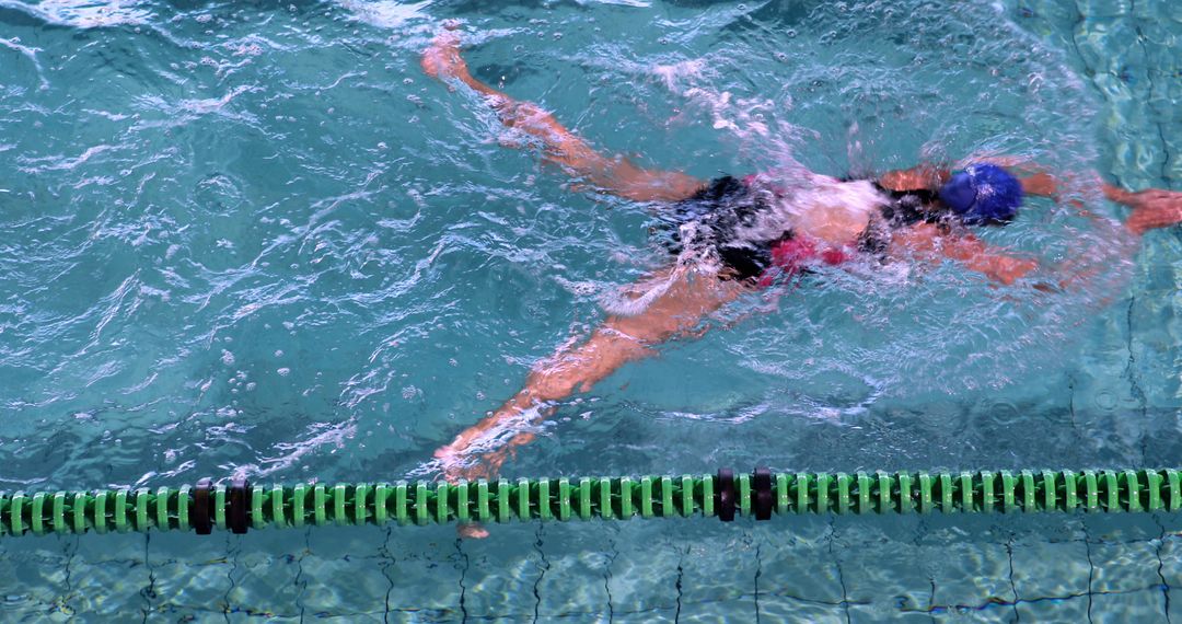 Swimmer Practicing Backstroke in Pool - Free Images, Stock Photos and Pictures on Pikwizard.com