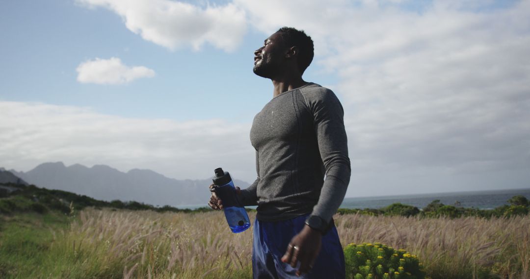 African American athlete taking break during outdoors workout, enjoying nature - Free Images, Stock Photos and Pictures on Pikwizard.com